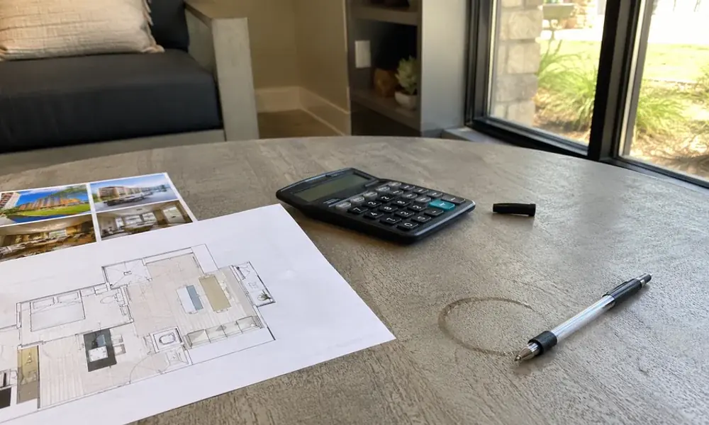 Lease-up concession flyer and calculator on a Fort Worth leasing office table