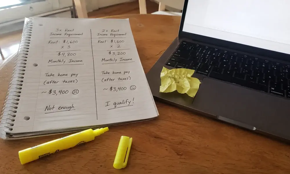 Notepad comparing 3x and 2x rent to income requirements for Fort Worth apartment leasing